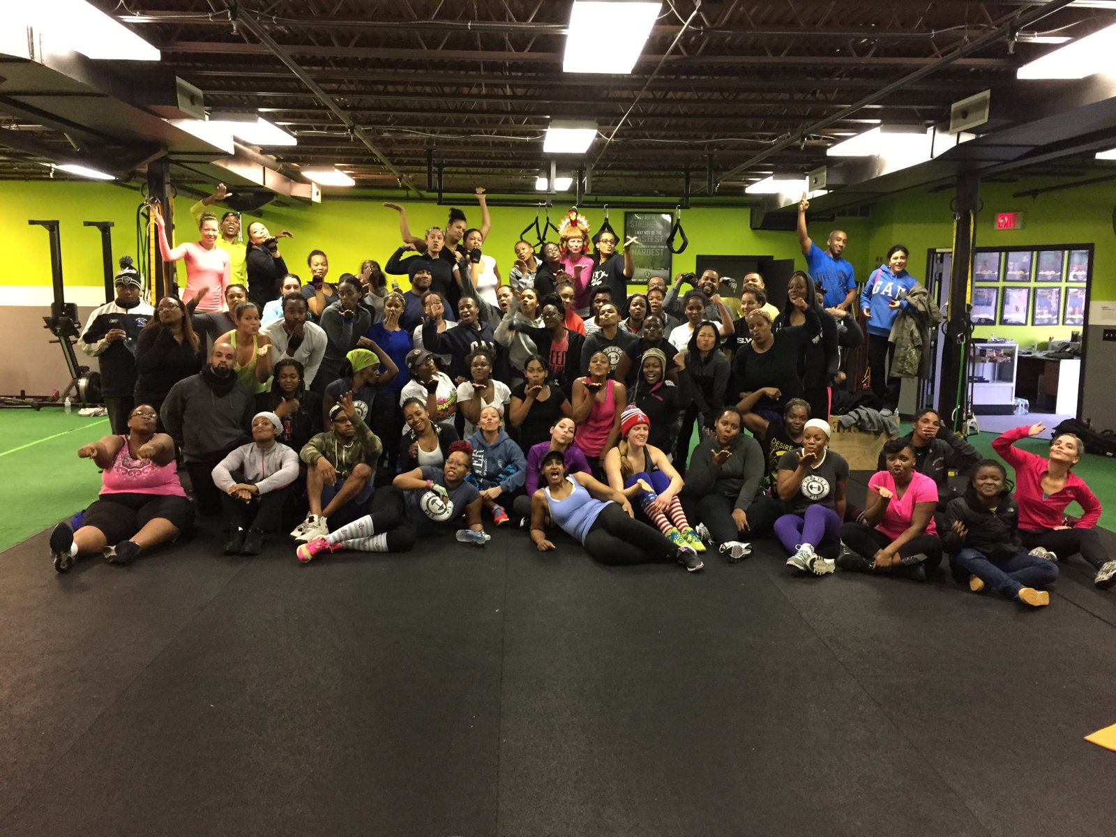 More than a hundred members of The F.I.T.T. PIT on the gym floor for a group photo